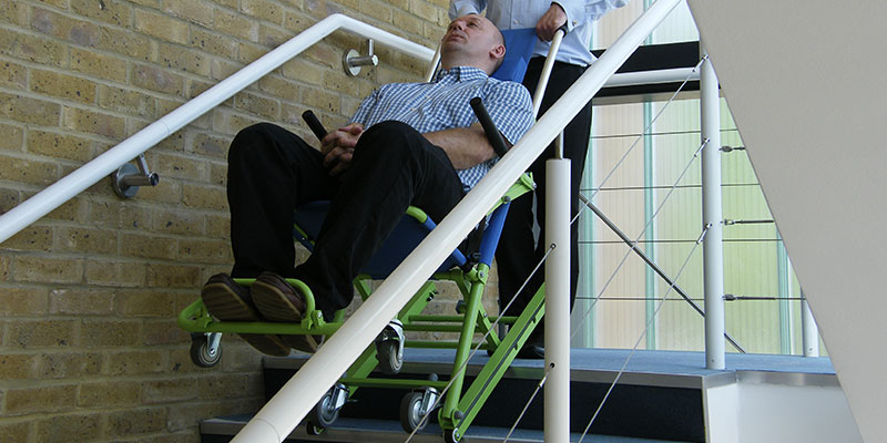 Evacusafe's standard evacuation chair being used for stairway evacuation procedure